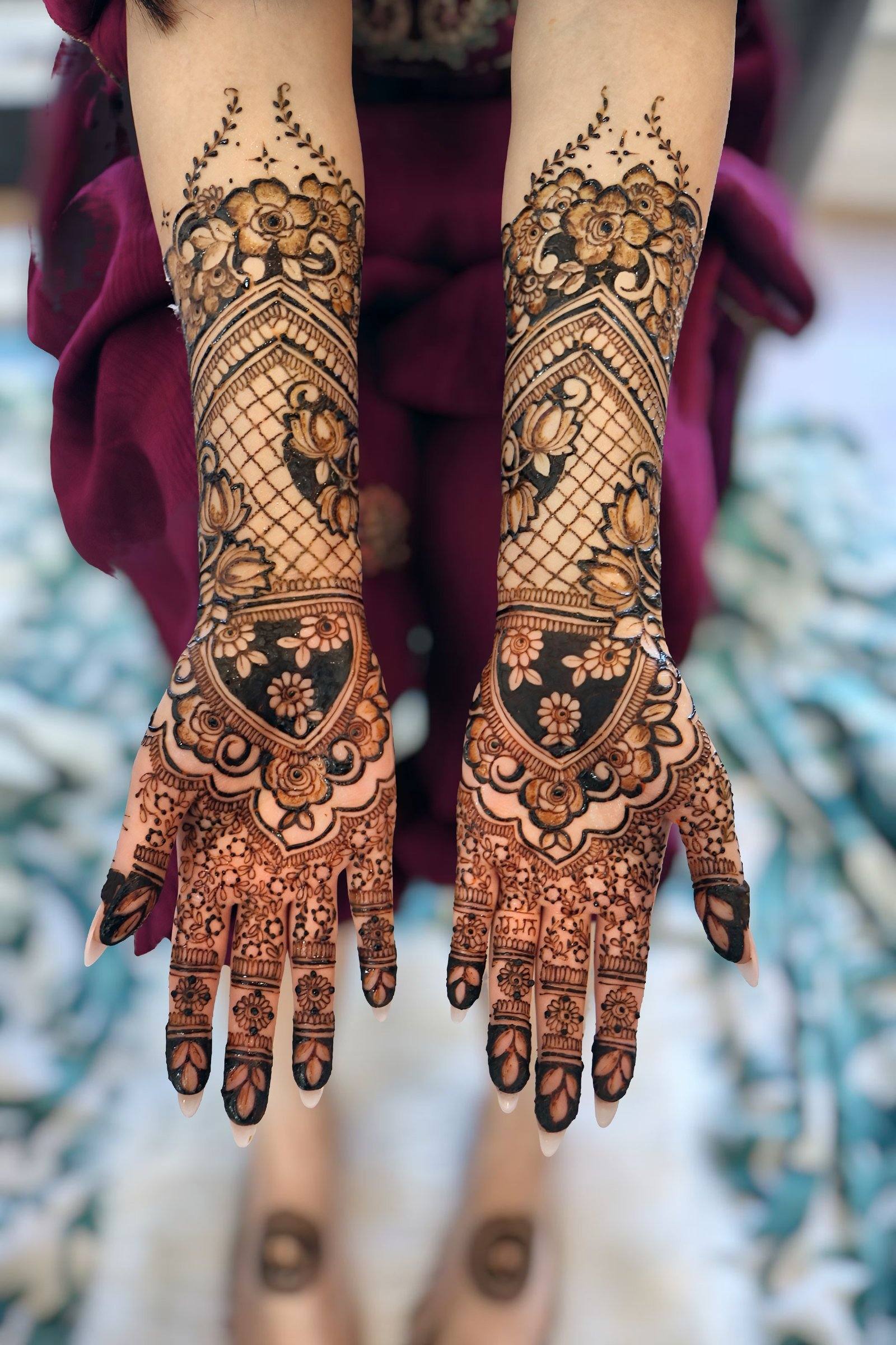 Bridal henna on backs of hands with florals and lattice