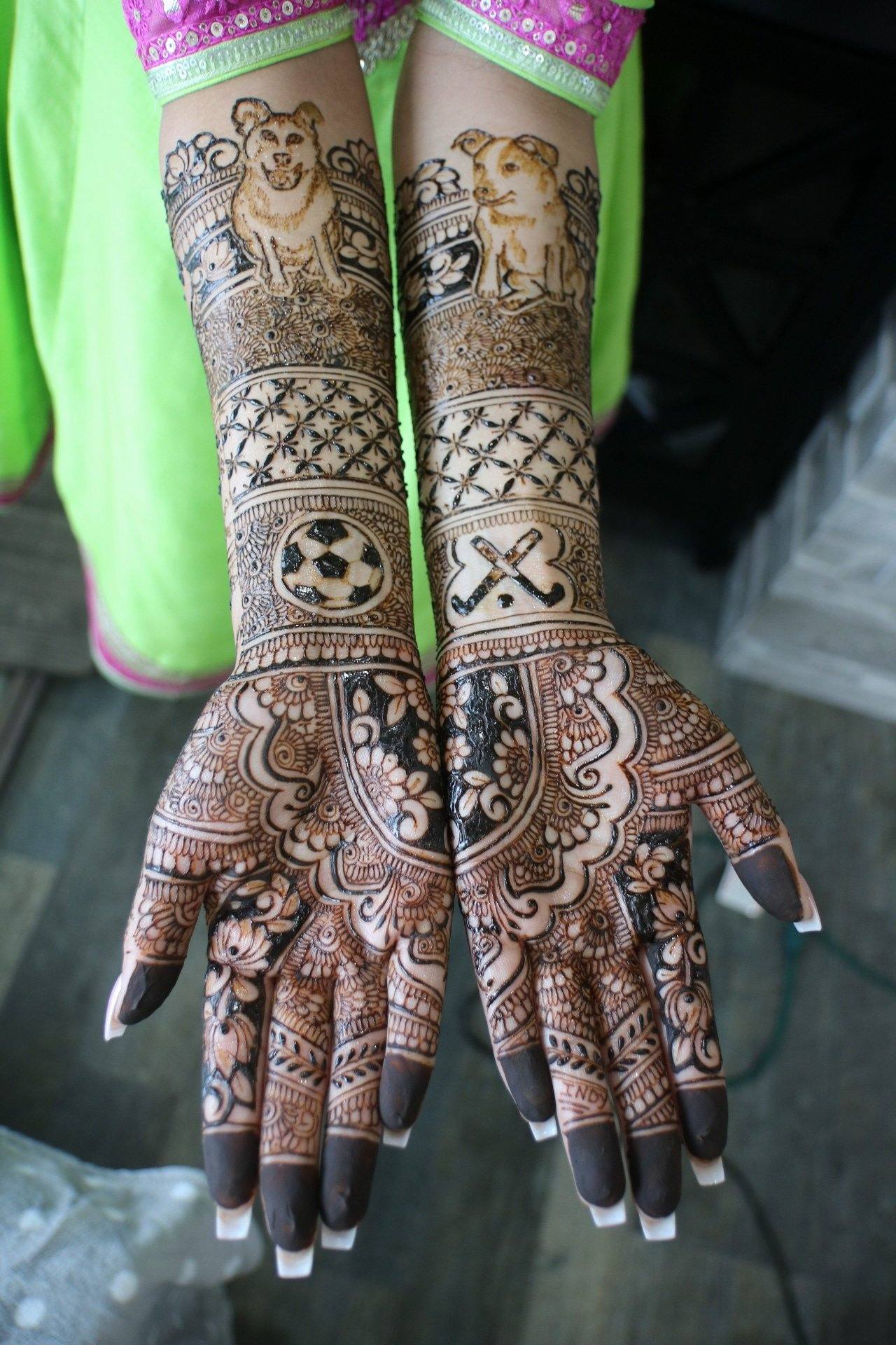 Personalised bridal henna with dog and sport motifs