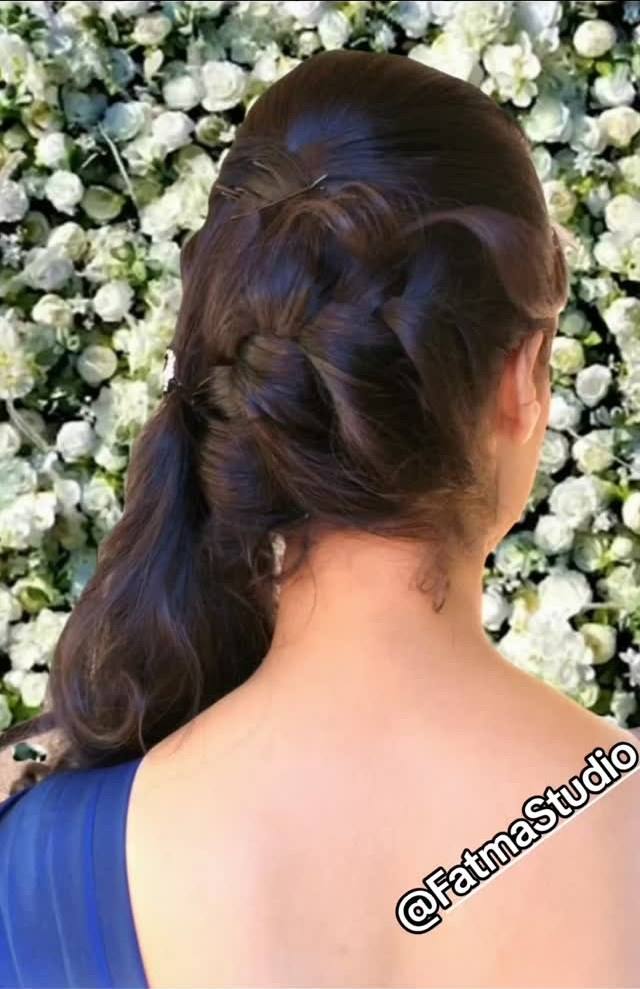 Textured braided ponytail swept to one side