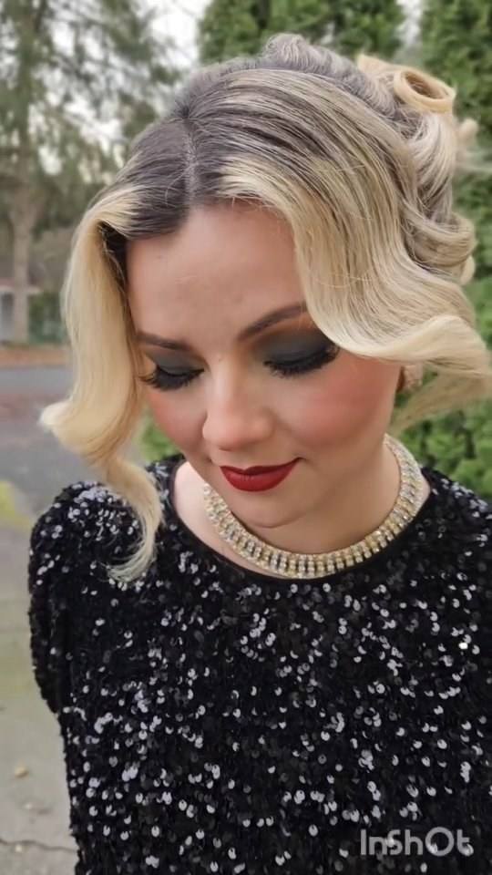 Smoky eye makeup with vintage blonde waves and a pearl necklace